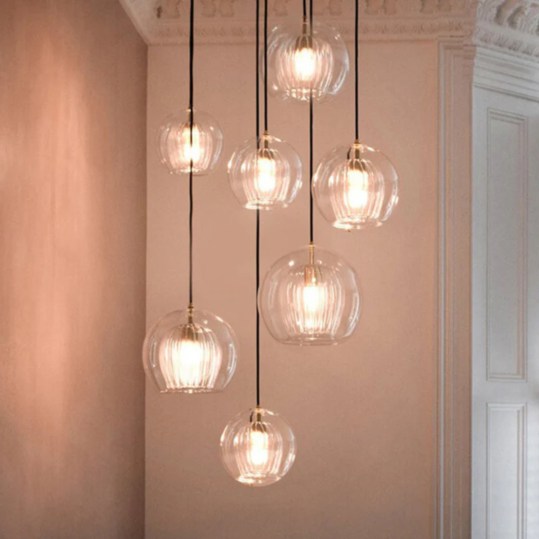 Sleek modern spherical LED pendant light, Aurora Sphere, enhances contemporary home interior design.
