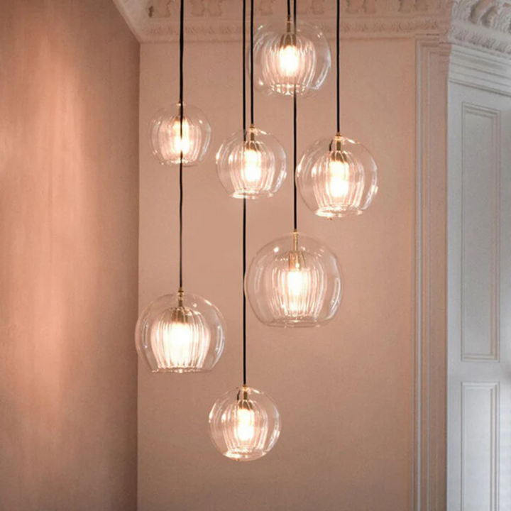 Sleek modern spherical LED pendant light, Aurora Sphere, enhances contemporary home interior design.