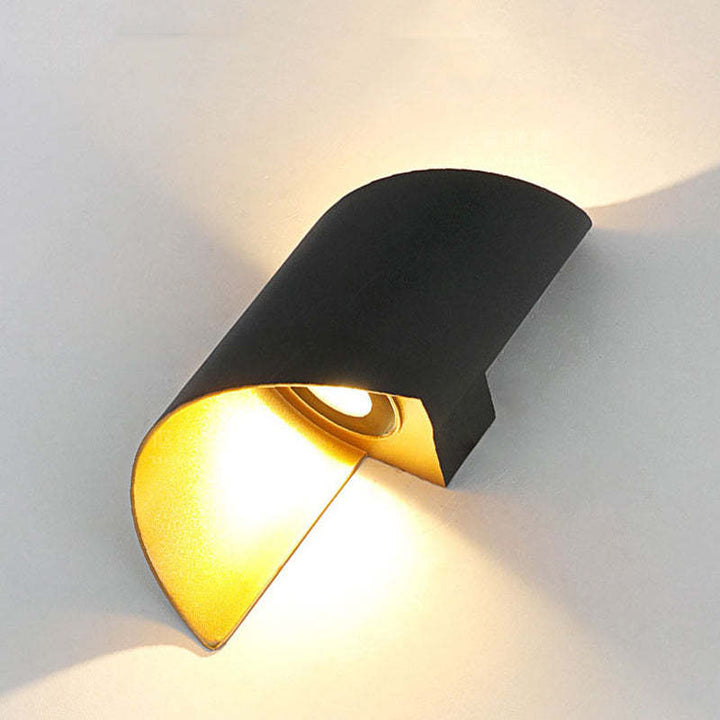 Contemporary spiral LED wall lamp, perfect for bedrooms or office spaces.
