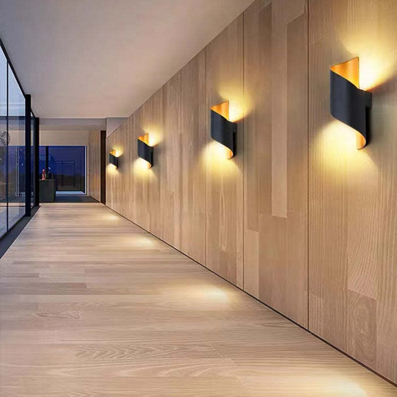 Sleek outdoor spiral LED wall lamp, TwistLight, brightens patio or garden.