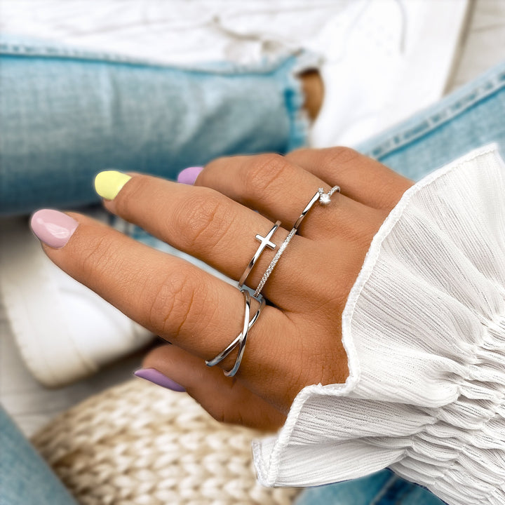 Minimalist double cross ring for women, sterling silver. Stackable modern jewelry, an elegant fashion accessory.