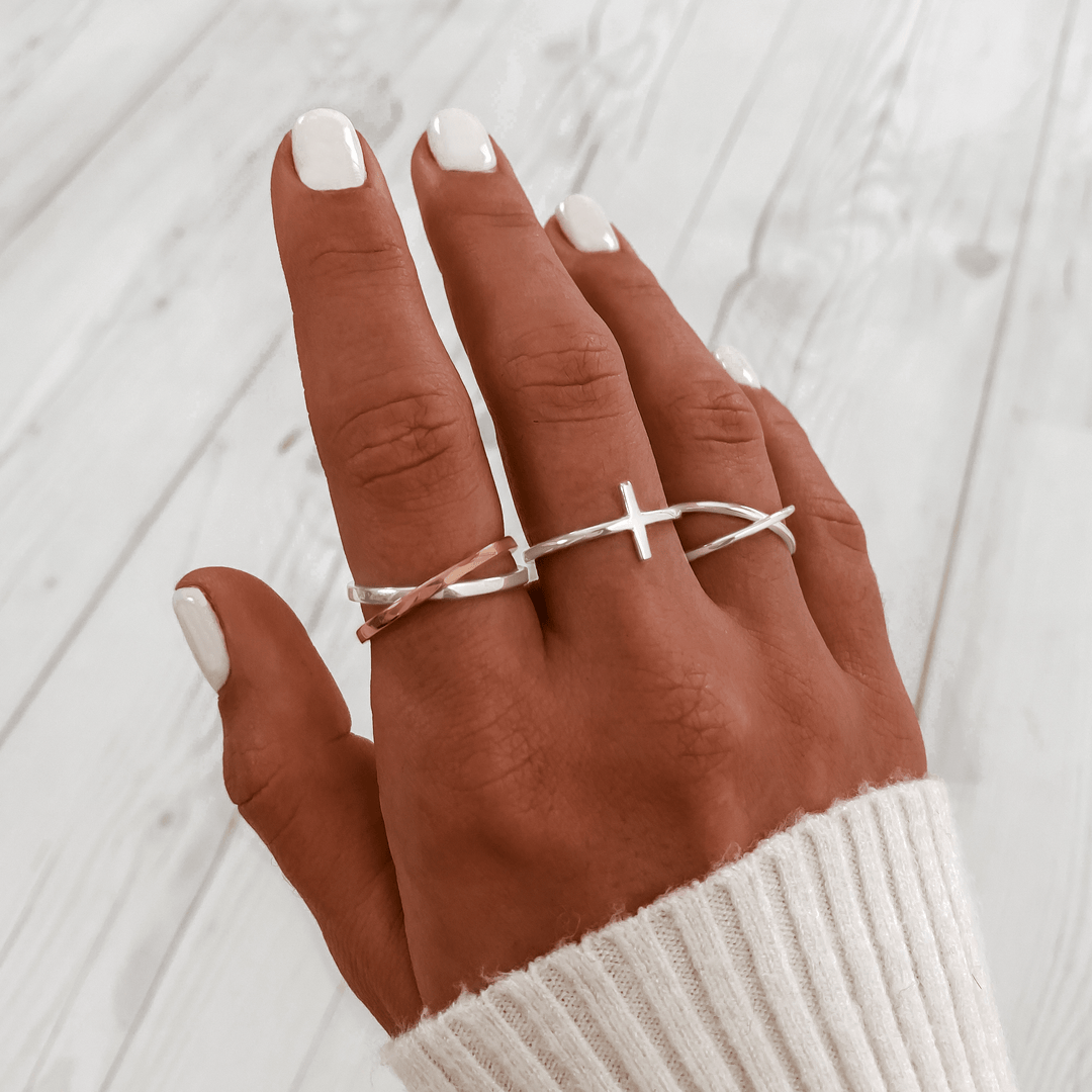 Calindra women's modern double cross ring. Gold plated minimalist design, an elegant and stylish fashion accessory.
