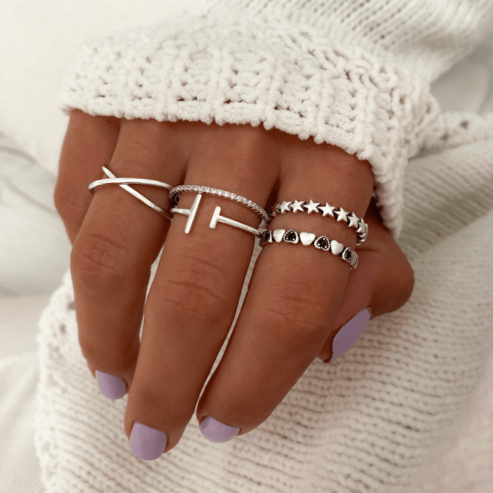 Sterling silver women's cross ring. Modern minimalist double cross design, an elegant and stackable jewelry piece.