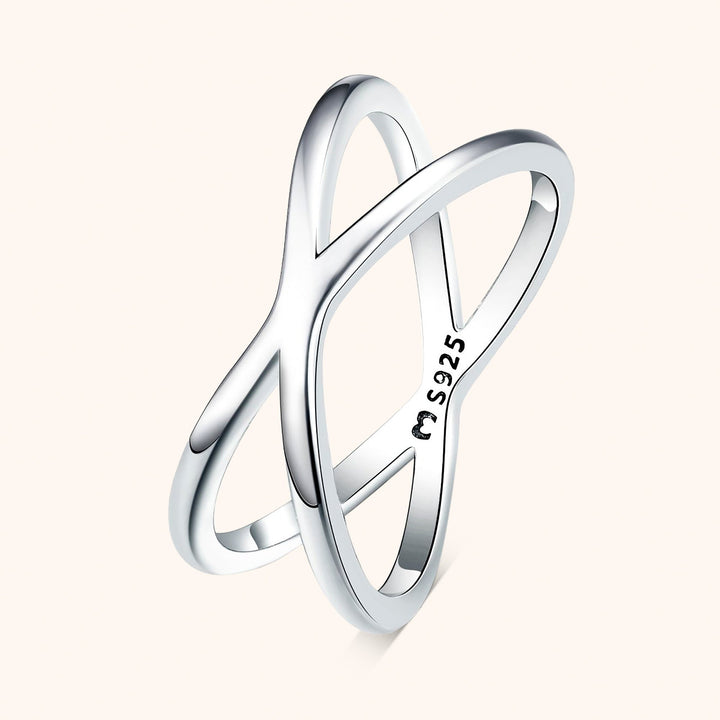 Modern double cross ring for women in sterling silver. Minimalist, elegant, and perfect as a stackable fashion ring.