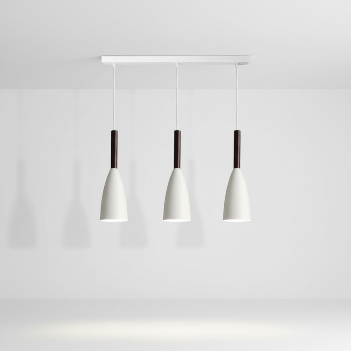 Contemporary triple pendant light, Scandinavian aesthetic. Ideal dining room or kitchen lighting.