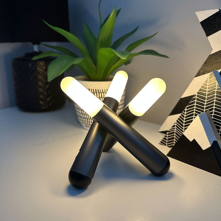 Rechargeable Trivela cordless table lamp with three movable heads, ideal for modern home decor