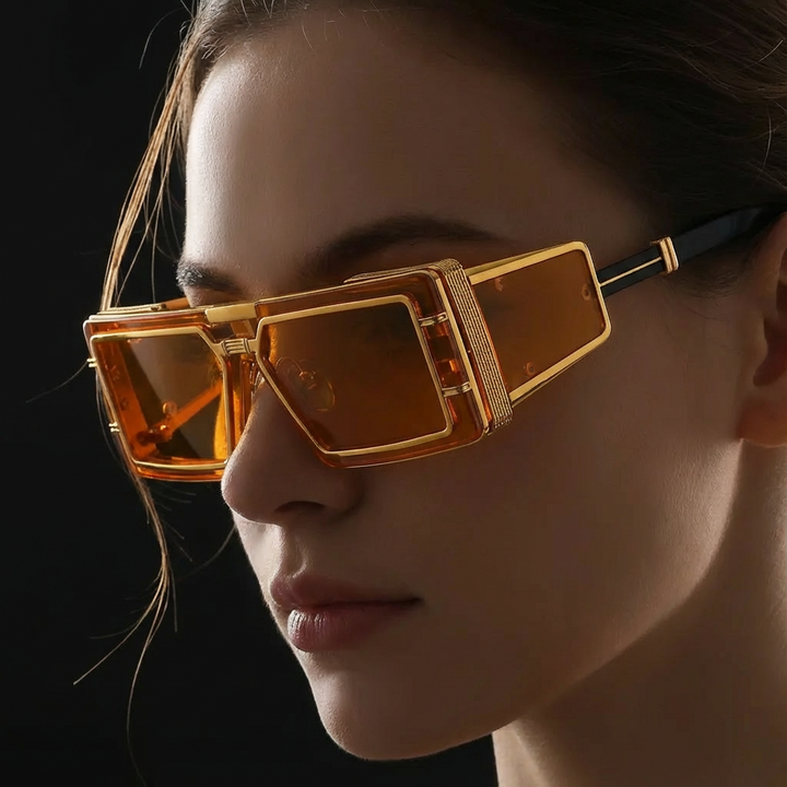 Close-up of modern unisex sunglasses, showcasing the elegant metal frame and UV400 protective lenses.