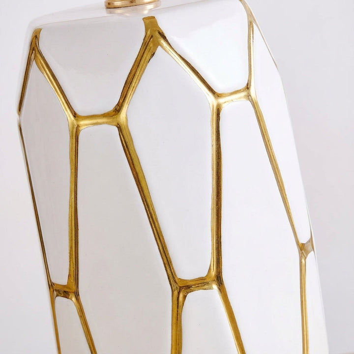Stylish ceramic table lamp; modern vintage design. Provides warm ambient light, ideal for home decor accents.