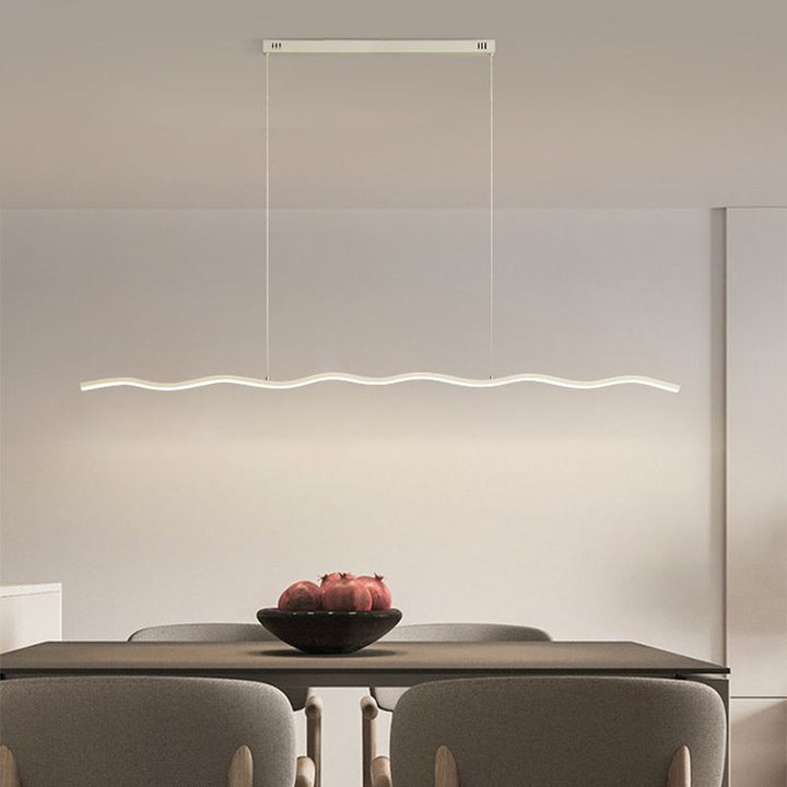 Elegant LED wave pendant light for dining room, adjustable height.