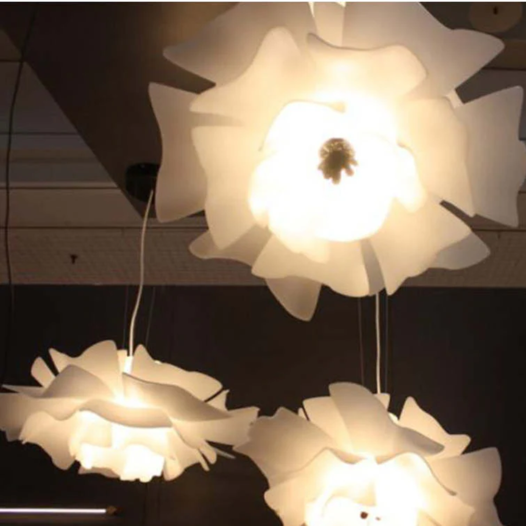 White flower pendant lamp for bedroom, modern acrylic & metal design. Stylish light.