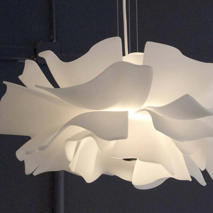Modern white flower pendant light, stylish home decor. Elegant metal design for any room.