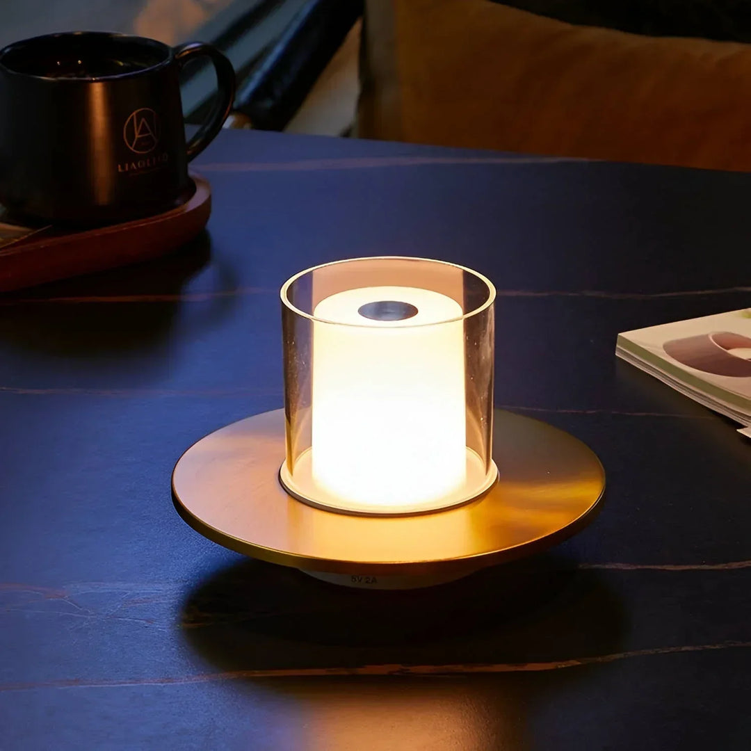 Silver LumiFlame LED candle lamp illuminating a room, powered by a rechargeable wireless design