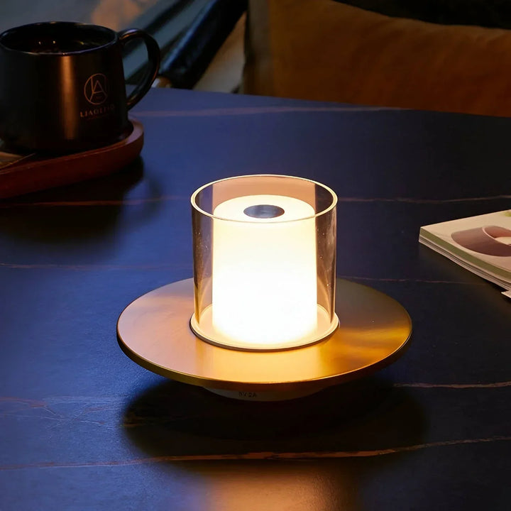 Silver LumiFlame LED candle lamp illuminating a room, powered by a rechargeable wireless design