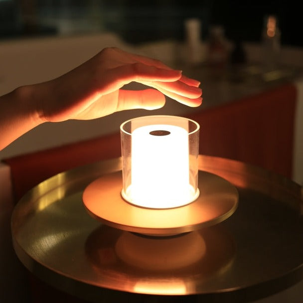Sleek silver wireless LED candle lamp, LumiFlame, with gesture control for modern interiors