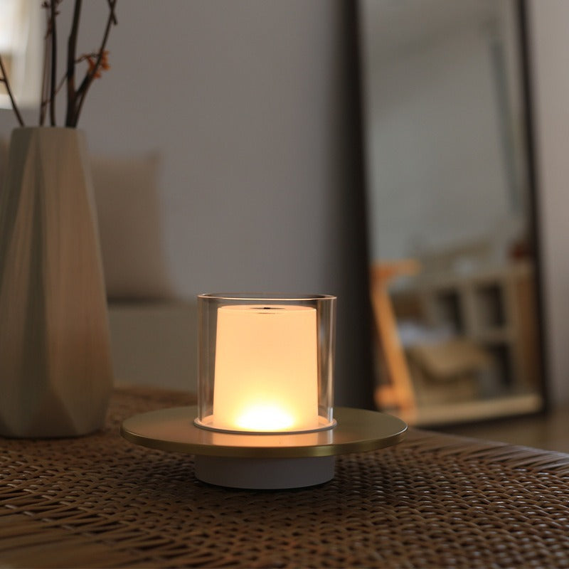 Silver LumiFlame wireless LED candle lamp casting a warm glow, perfect for home decor