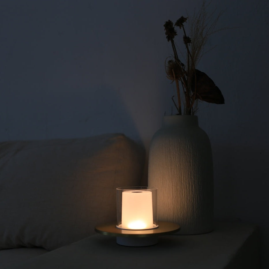 Portable LumiFlame LED candle lamp, gold finish, for flexible ambient lighting and home decor