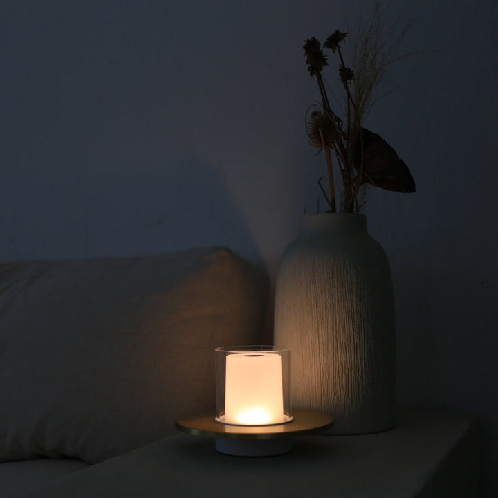 Portable LumiFlame LED candle lamp, gold finish, for flexible ambient lighting and home decor