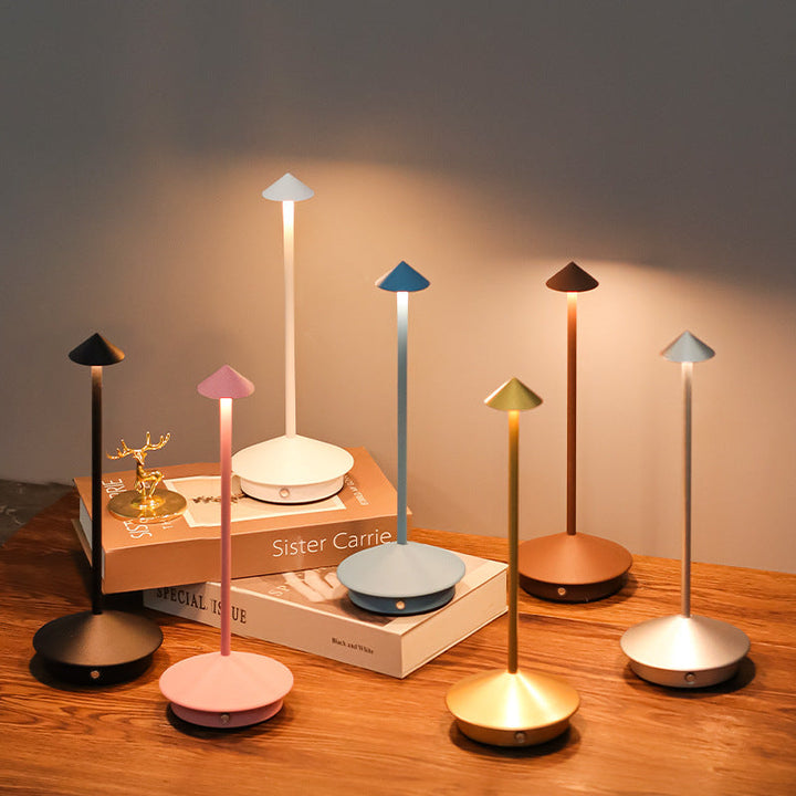 Modern wireless LED table lamp for indoor & outdoor use, dimmable ambient light, touch control, USB rechargeable.