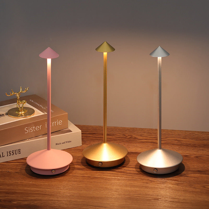 Rechargeable LED table lamp with touch control, wireless & dimmable, perfect for indoor/outdoor ambient lighting.
