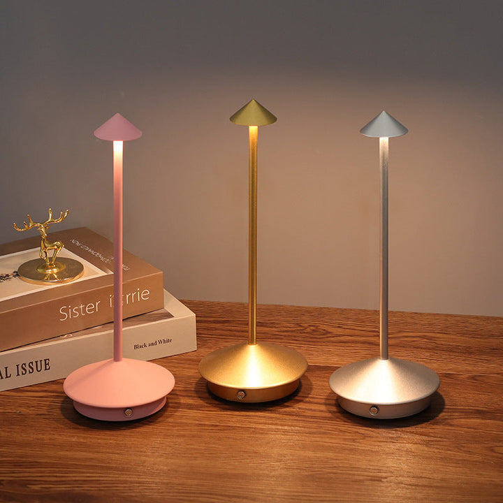 Rechargeable LED table lamp with touch control, wireless & dimmable, perfect for indoor/outdoor ambient lighting.