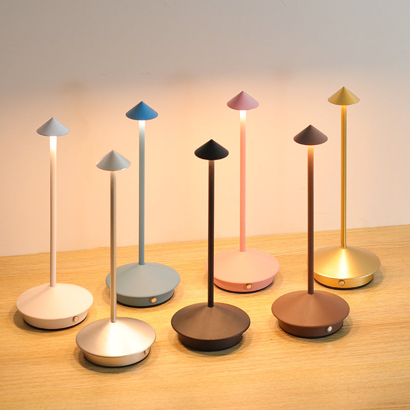 Versatile wireless LED table lamp, modern design for indoor/outdoor home decor, dimmable & portable.