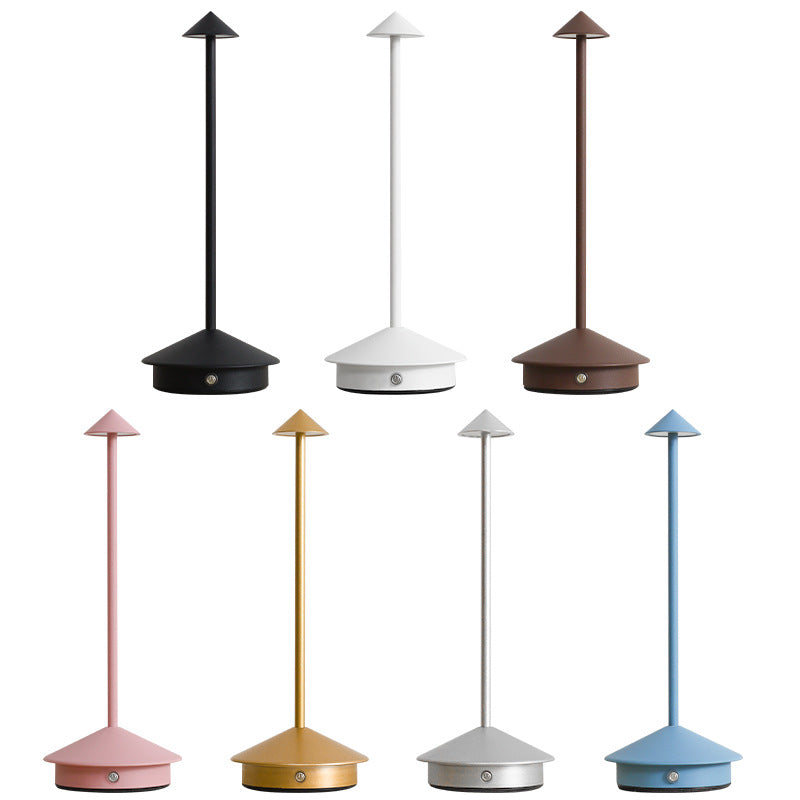 Chic wireless LED table lamp, USB rechargeable, provides dimmable ambient light for indoor & outdoor spaces.