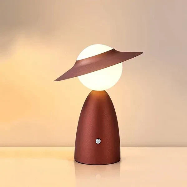 Stylish dimmable wireless table lamp in metal, ideal for modern home office decor or ambient bedside lighting.