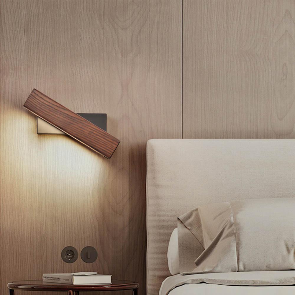 Sleek wooden LED wall lamp with pivot function, offering adjustable light, ideal for modern home lighting.