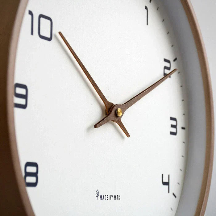 Decorative wooden wall clock featuring clean lines, ideal for modern homes and quiet environments.