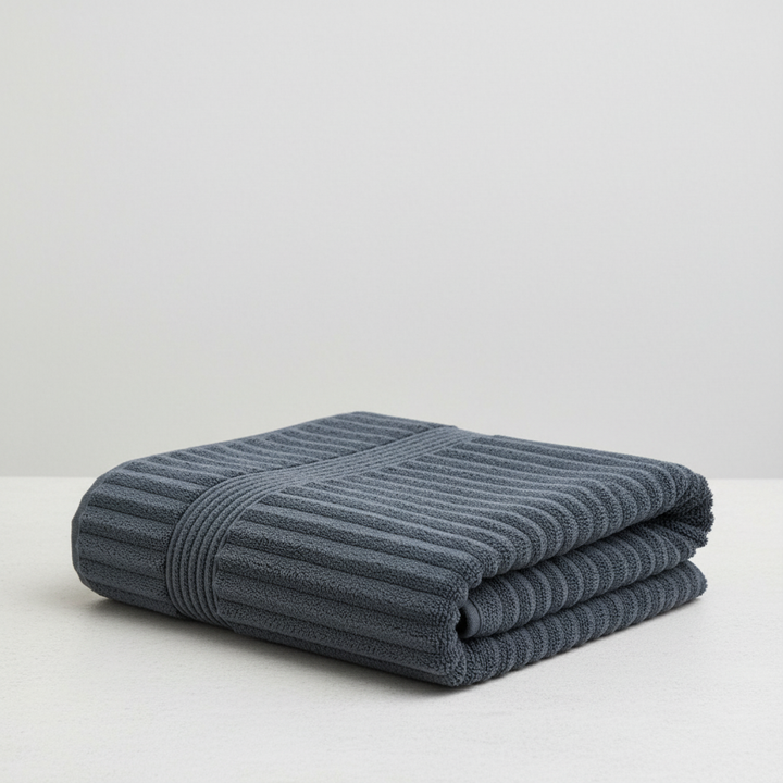 Soft and absorbent coral fleece bath towel, ideal for post-shower use or as a gym towel.