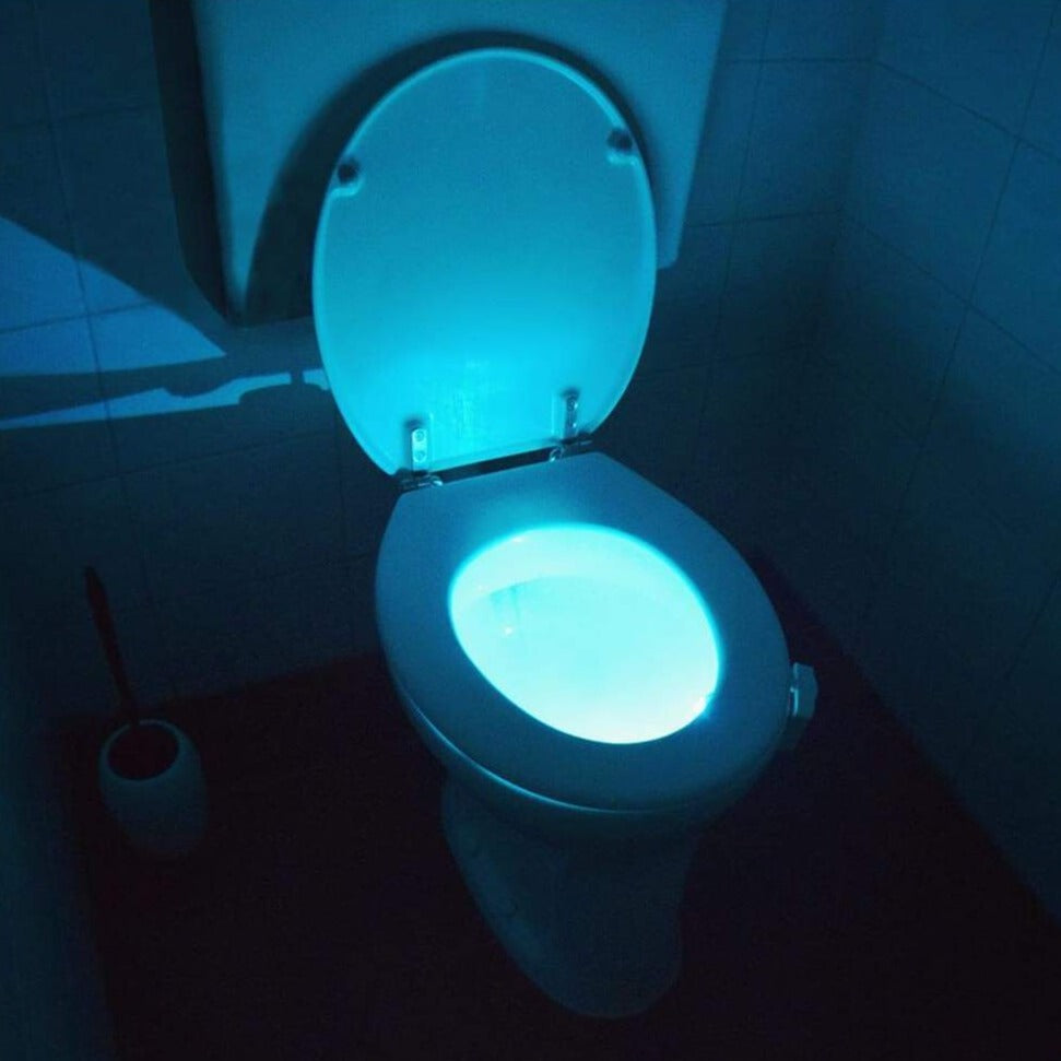 GlowBowl motion sensor toilet night light illuminating a toilet bowl with a soft, energy-saving LED light
