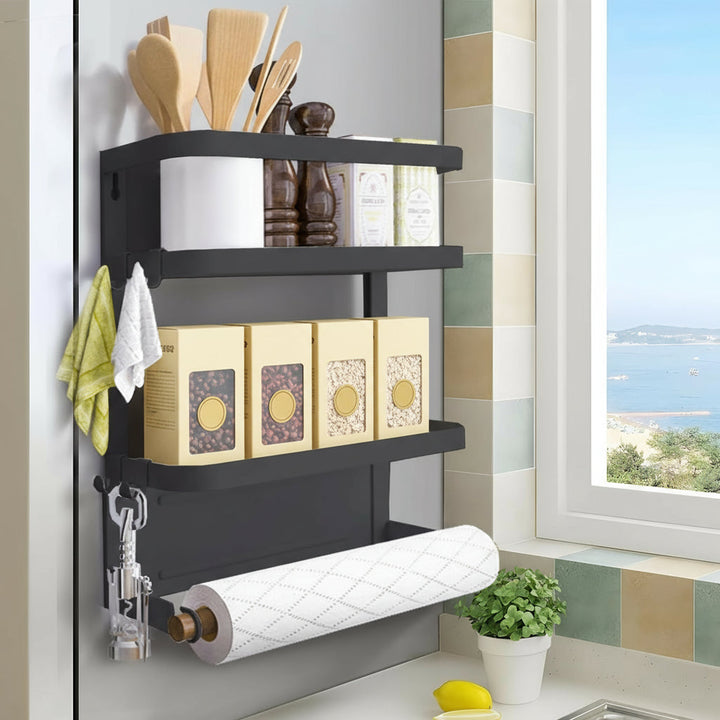 Multifunctional magnetic fridge spice rack with paper towel holder in black, ideal for kitchen organization.
