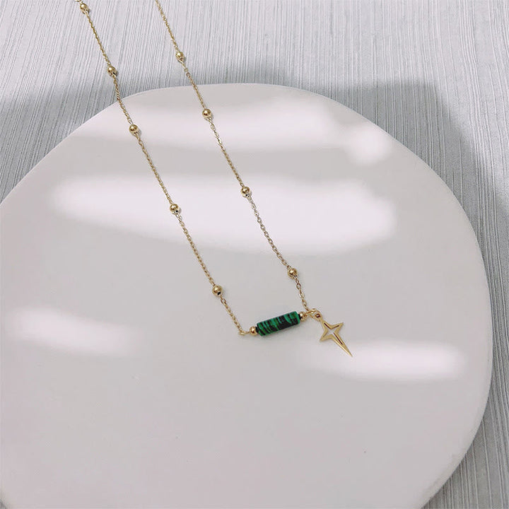 Elegant women's natural Malachite star pendant necklace. Sterling silver, green stone celestial jewelry accessory.
