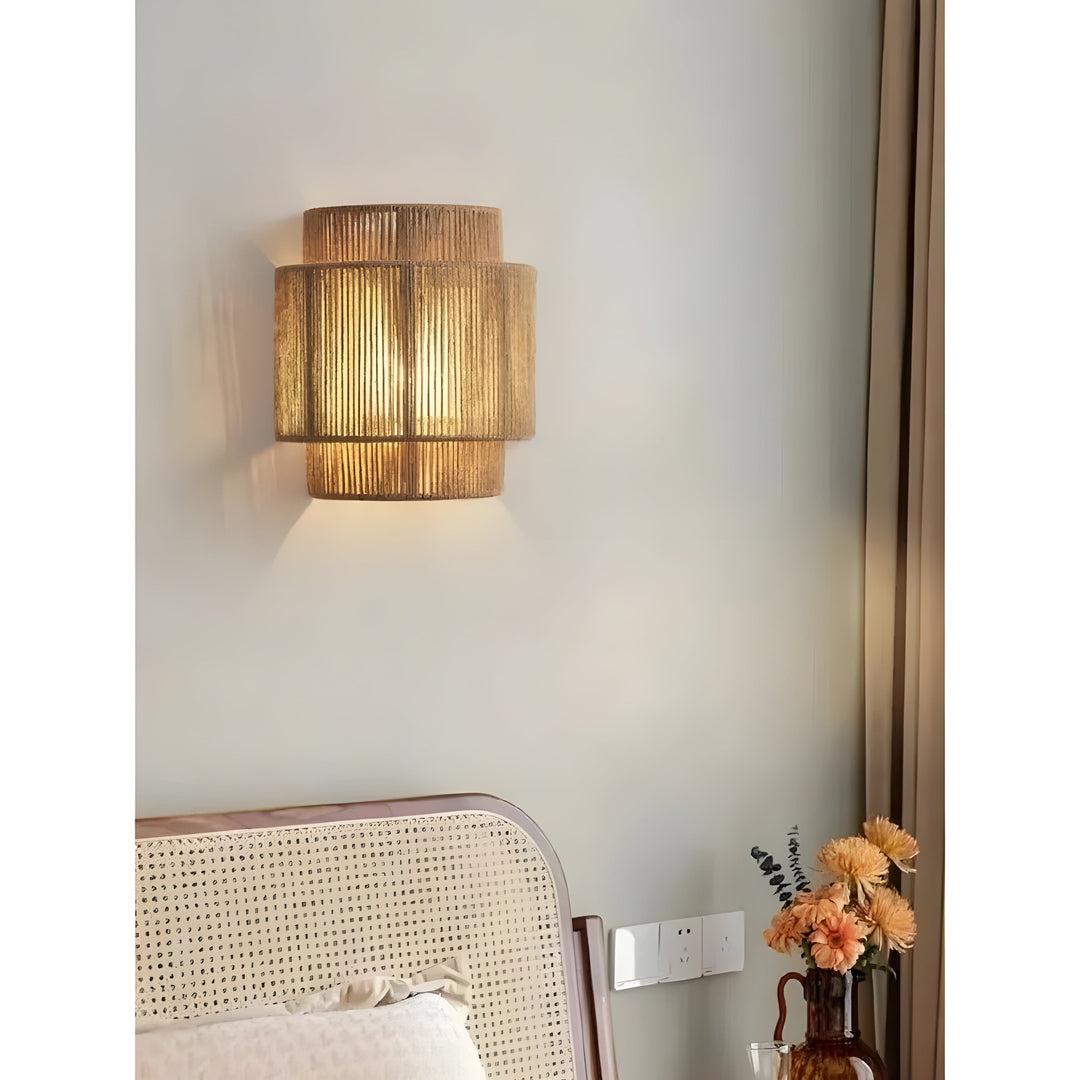 Close-up of intricate woven rattan wall lamp, showcasing natural texture & handmade quality.
