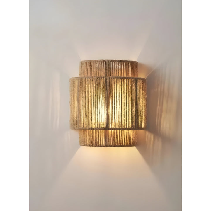 Elegant natural rattan wall lamp, providing contemporary accent lighting for home decor.
