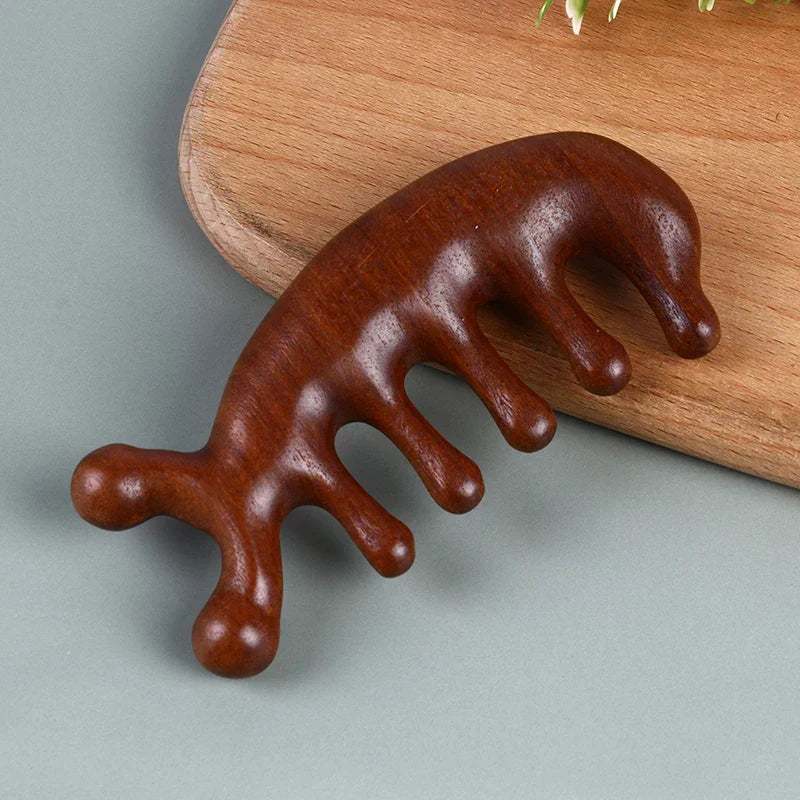 Natural sandalwood scalp massage comb. Gently stimulates hair growth, detangles, and promotes relaxation for healthy hair.