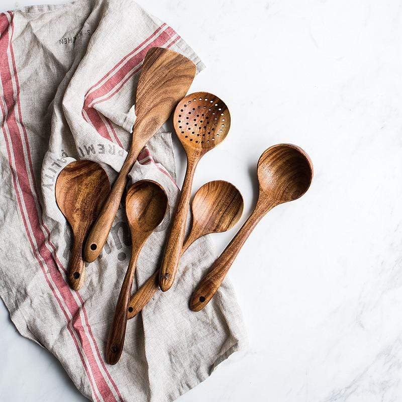 Smooth natural wood spoon, part of a sustainable cooking utensil set for your kitchen.