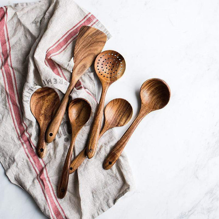 Smooth natural wood spoon, part of a sustainable cooking utensil set for your kitchen.
