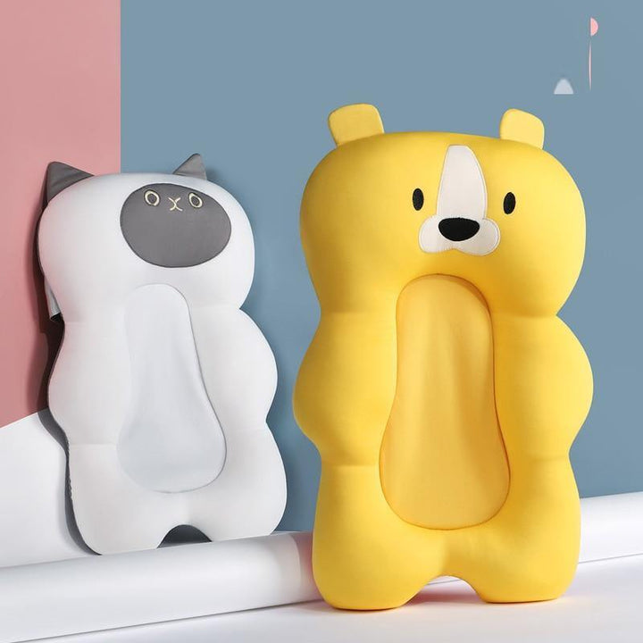Comfy infant bath support cushion. Anti-slip, quick-dry design for safe newborn bathing. A baby essential.