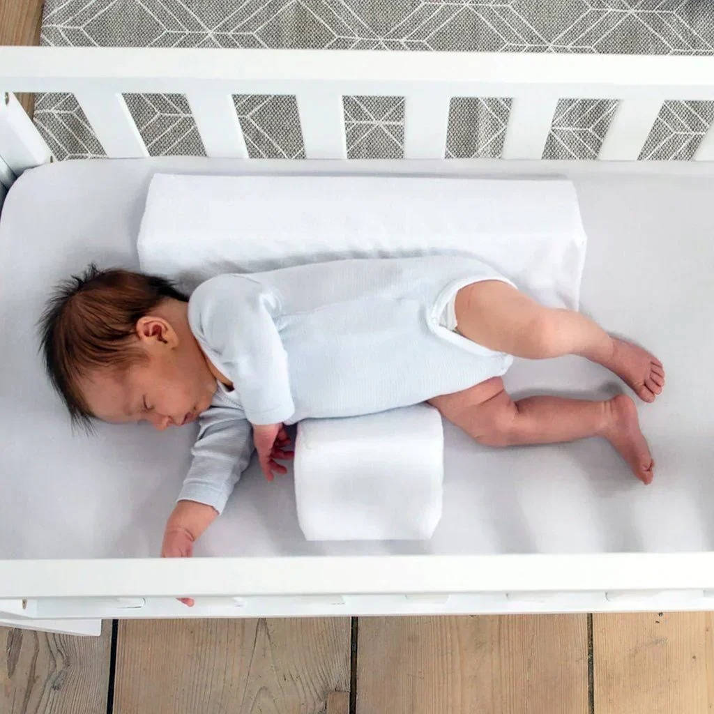 Newborn side sleeper wedge for longer, safer, uninterrupted baby sleep.