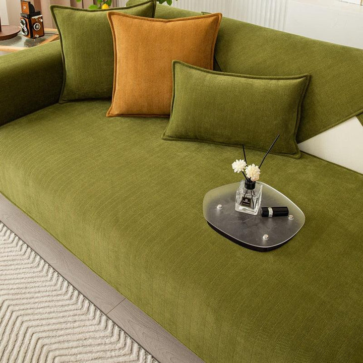 Stylish gray non-slip sofa cover with SnugMat technology. Durable polyester couch throw for home decor.
