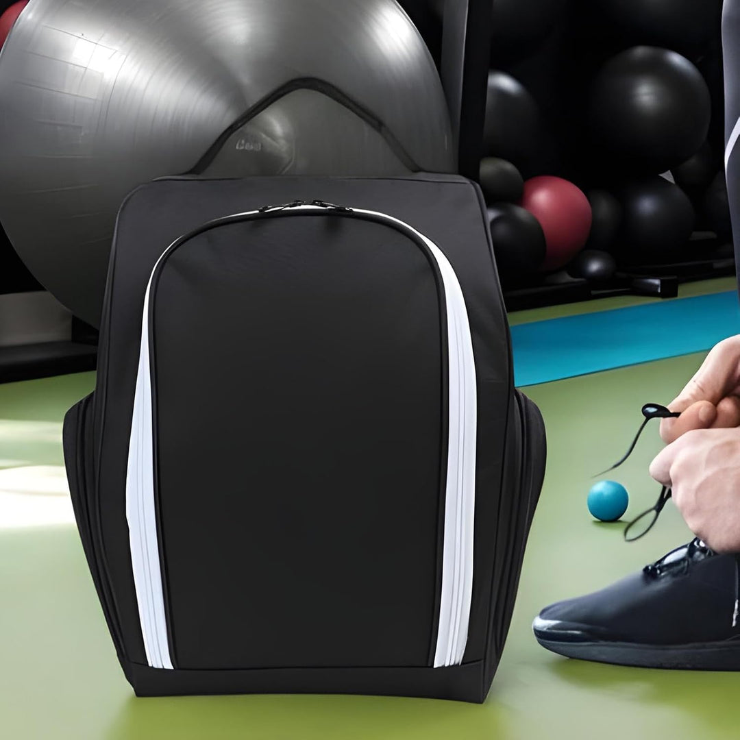 User carrying Olviano waterproof golf shoe bag by the handle, athletic context