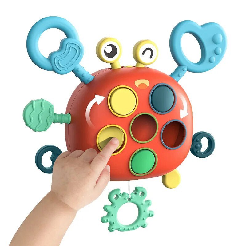 Orange plastic interactive sensory crab toy for babies, boosting motor skills & infant development. Safe & engaging activity.