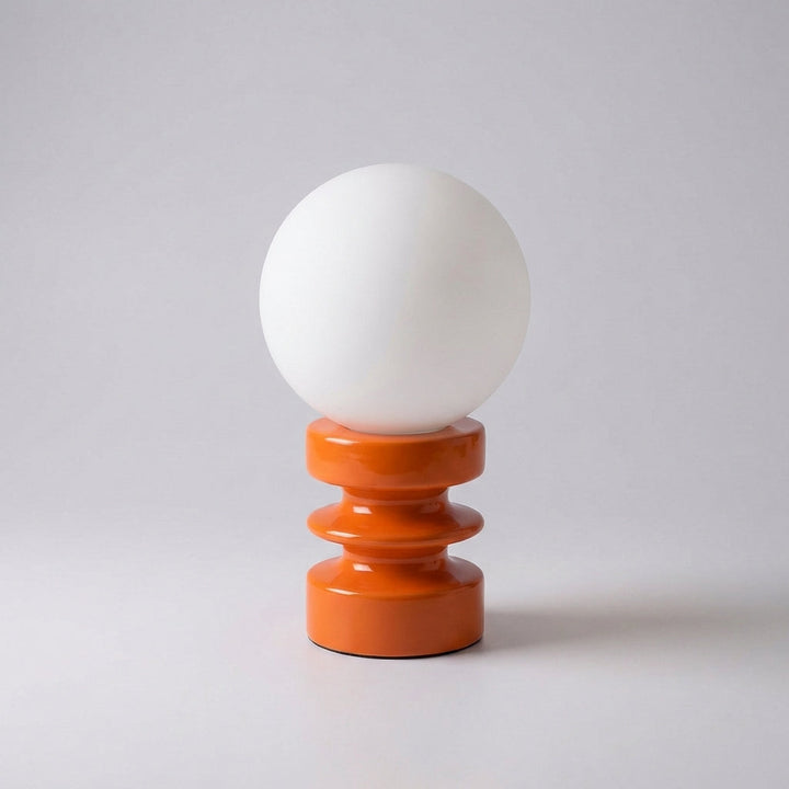 Compact Orbisio globe lamp illustrating its perfect size for a bedside table or small desk, LED ready