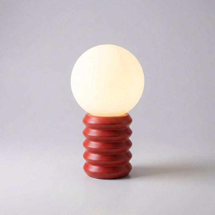 Modern Orbisio table lamp with a distinctive globe design and solid wood stand, great for accent lighting