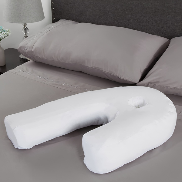 Ergonomic side sleeper pillow with ear hole for fibromyalgia, arthritis, & C-PAP users. Provides neck support.