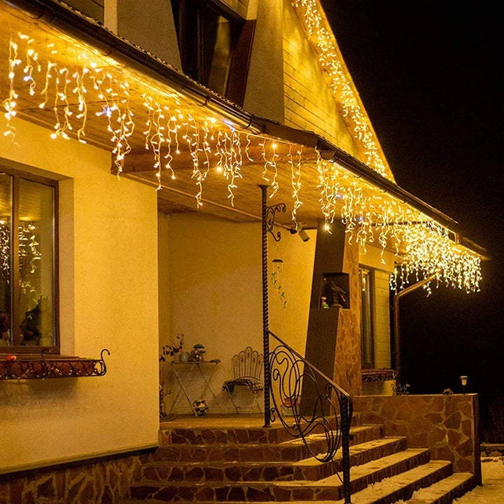 Outdoor LED icicle string lights for festive holiday & winter decor. Bright, energy-efficient illumination.