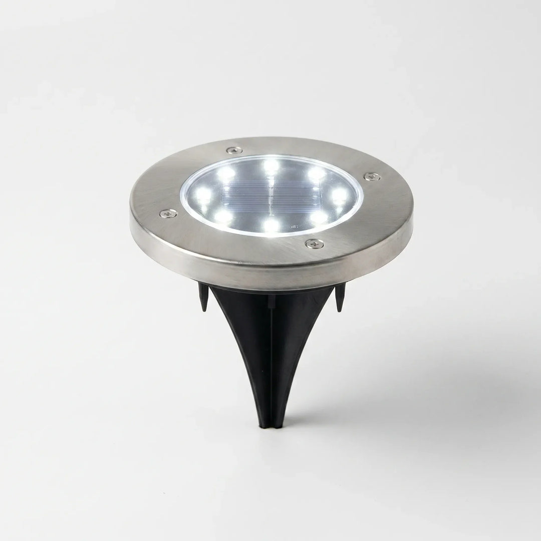 Solar powered LED ground lights for outdoor garden and pathway illumination. Energy-efficient & waterproof.