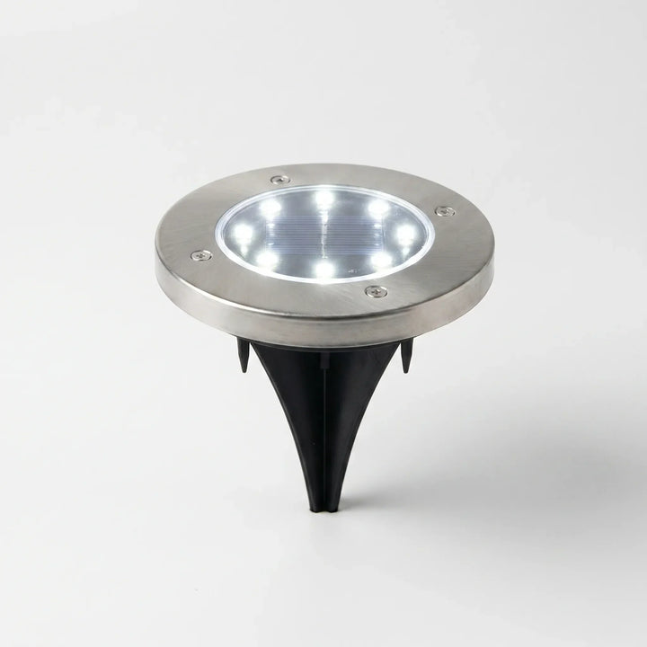 Solar powered LED ground lights for outdoor garden and pathway illumination. Energy-efficient & waterproof.