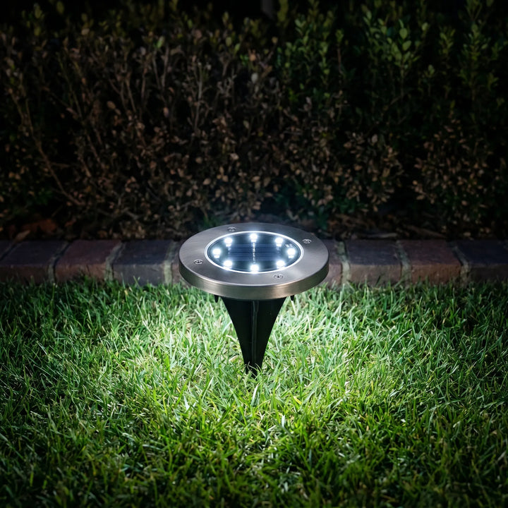 Bright LED solar ground lights, perfect for illuminating garden pathways, driveways, and outdoor spaces.
